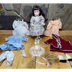 Vintage Porcelain Doll 11" Brown Hair Blue Eyes w/ 5 dresses Hats, shoes,hangers